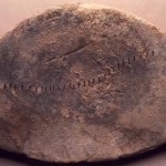 S. Anastasia - Sardara (CA). Lingotto di piombo di forma ellittica, " a macina", con impressioni a segmentini (VIII sec. a.C.).